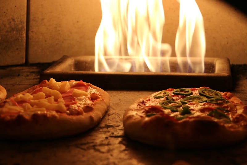 Coal fired pizza oven glowing with heat
